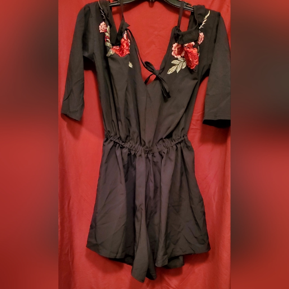 Black floral romper size Large off shoulder